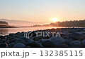 The morning sun rises over the river 132385115