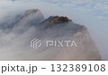 Mt. Ishizuchi with gas flowing, sea of clouds in the background, stationary drone 132389108