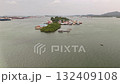 A beautiful aerial view of a colorful coastal village with water bound homes showing the harmony between human life and the calm sea environment 132409108
