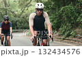 young asian cyclists training on rural road	 132434576