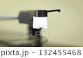 close up view of the turn table with the spinning vinyl disc and the needle 132455468