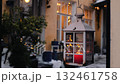 Elegant lantern hanging outside a cozy home during winter evenings with festive lights 132461758