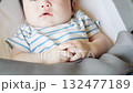 Baby crying while sleeping in a cradle 132477189