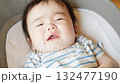 Baby crying while sleeping in a cradle 132477190
