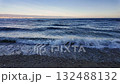 Waves crashing on the Adriatic Sea coastline. Blue waves with white foam swirling and splashing on the beach. Close-up of disquiet sea surface on the beach of Medveja, Croatia. 132488132