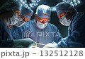 Surgeons performing operation in operating room 132512128