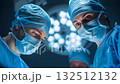 Surgeons performing surgery in operating room 132512132