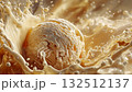 Creamy vanilla ice cream ball making a splash crown falling into a milkshake 132512137