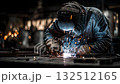 Industrial welder working on metal construction in factory 132512165