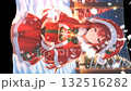 Christmas image: A beautiful girl in a Santa costume printed on a flag. Snow falling and swaying in the wind. Vertical material. Loopable. 132516282