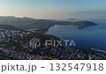 Aerial drone video of Kas coast at sunrise with calm blue sea, islands, and hills glowing in warm morning light. 132547918