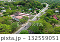 Modern highway cutting through natural scenery, Aerial drone footage of road in forested area, Transportation route amidst lush vegetation 132559051