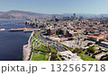 Aerial view of Izmir city in Turkey showing coastline, skyscrapers, and Konak Square on a sunny day. Clock Tower 132565718
