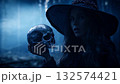 Halloween witch holding a skull standing over dark forest and tree, Halloween mystery concept, Generative AI 132574421