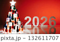 Colorful nail polish bottles arranged as a festive Christmas tree with bold 2026 numbers, camera zooms in to highlight vibrant details and textures 132611707