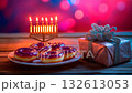 Cozy festive Hanukkah display with sufganiot, menorah, and wrapped gifts set against a colorful background 132613053