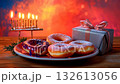 Cozy festive Hanukkah display with sufganiot, menorah, and wrapped gifts set against a colorful background 132613056