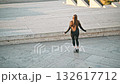 Yerevan, Armenia 24.10.2025 Cascade. A woman is jumping in the air with a jump rope. The image has a light and energetic mood 132617712