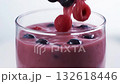 closeup glass filling berry smoothie blueberries, highspeed pour with floating fruit, white clean background, light condensation, fresh vibrant color for beverage ad and social media 132618446