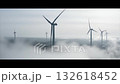 foggy drone scenery, drone patrol over peaceful foggy windmill scene with soft lighting, serene drone imagery capturing tranquil wind turbines enveloped in dense morning fog and gentle light 132618452