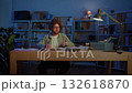 Young Man Celebrates with Raised Fists After Long Night Study. Concept of Academic Success, Exam Preparation, Hard Work Payoff, Motivation, Stress Relief, and Achieving Study Goals at Desk. 132618870