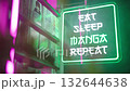 Futuristic neon sign beside manga comics shelf Eat Sleep Manga Repeat 4K 132644638