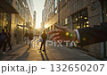 People Walking on a Street Near Buildings During Sunset in an Urban Area 132650207