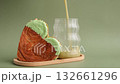 Stop motion of Nutrient-rich matcha drink with Green latte Matcha tea coffee with Delightful and vibrant heartshaped pastry croissant treat, beautifully topped with colorful frosting nut galore. Mock 132661296