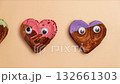 Stop motion Funny personalized eyes Creative ides Valentine's Day flat lay top view Holiday celebration Heart shaped different variety flavor croissants on beige background. Puff pastry new trendy 132661303