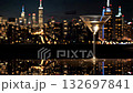 closeup glass of luxury martini drink on big city skyline background, rooftop on skyscraper of Manhattan, nightlife 4k 132697841