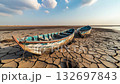 abandoned wooden boats on cracked dry earth in arid landscape, harsh conditions and lack of water in area of drought, climate change and global warming consequences concept 4k 132697843