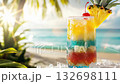 colorful tropical cocktail with pineapple and cherry on a sunny beach in summer 4k 132698111