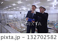 Executive manager and engineer inspecting food processing factory. 132702582