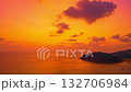 Aerial hyper lapse view of A stunning seascape capturing the vibrant colors of a dramatic sunset sky over a calm beach, Picturesque Tropical Sky at Sunset at Kala island Layan beach Phuket 132706984