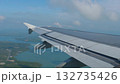 View of airplane wing above sea 132735426