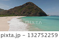 Pantai Tomang Omang, Lombok: pristine white sand beach with turquoise water, gentle waves and lush green hills under a clear blue sky, tranquil tropical island scenery for travel and conservation Pantai Tomang Omang, Lombok: pristine white sand beach with turquoise water, gentle waves and lush green hills under a clear blue sky, tranquil tropical island scenery for travel and conservation 132752259