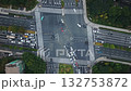 Aerial top down view of city intersection shows traffic movement during daylight in Hangzhou, China 132753872