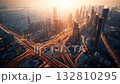 Sunset over a busy city skyline with illuminated highways and tall buildings in Dubai 132810295