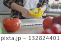 Cleaning Yellow Bell Pepper For Fresh Salad Preparation In Modern Kitchen 132824401