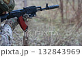 Soldier fires a suppressed tactical rifle. 132843969