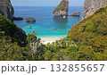 Aerial view of tropical beach and turquoise sea at Phi Phi Islands, Thailand, with white sand, limestone cliffs, and boats in scenic paradise. 132855657