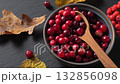 Fresh cranberry in bowl autumn setting natural sweetness. 132856098