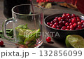 Revive your senses with refreshing cranberry-infused mocktail featuring lime and mint. 132856099