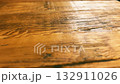 Macro texture of treated hardwood table surface in cafe interior 132911026