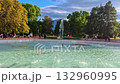 Sofia, Bulgaria - 8.31.2025. Summer at South Park main fountain water splashes. People walking, cycling, and relaxing outdoors in a peaceful urban park surrounded by greenery. Blue sky with clouds and 132960995