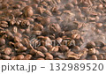 Slow motion of roasted coffee beans falling with smoke. Organic coffee seeds. 132989520