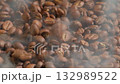 Slow motion of roasted coffee beans falling with smoke. Organic coffee seeds. 132989522
