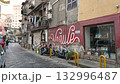 Naples, Italy, December 30, 2024. View of Via delle Fontanelle, the picturesque atmosphere of the Sanita district. A mural with the word "Napoli" written on it. 132996487