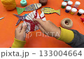 creative fish made of cardboard materials, thread and paint, step-by-step instructions, orange background 133004664