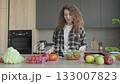 Smiling Woman Enjoying Homemade Salad With Fresh Vegetables At Home 133007823